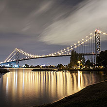 ambassador bridge at night time over water