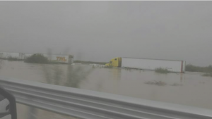 flooding in laredo, trucks in deep water