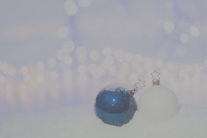 blue and white ornaments in the snow